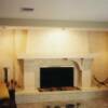 basement fireplace with marble mosaic hearth