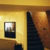 basement showing plaster brick stairwell walls - AV access is behind hidden panal