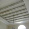 distressed wood beams installed in dining room